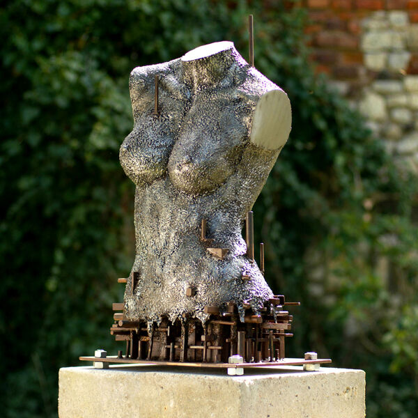 Textured metal torso sculpture on a plinth by Blotnicki Metal Design
