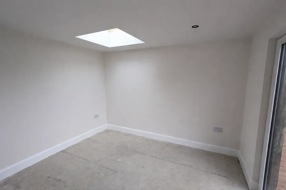 Plastered and painted room with a rooflight