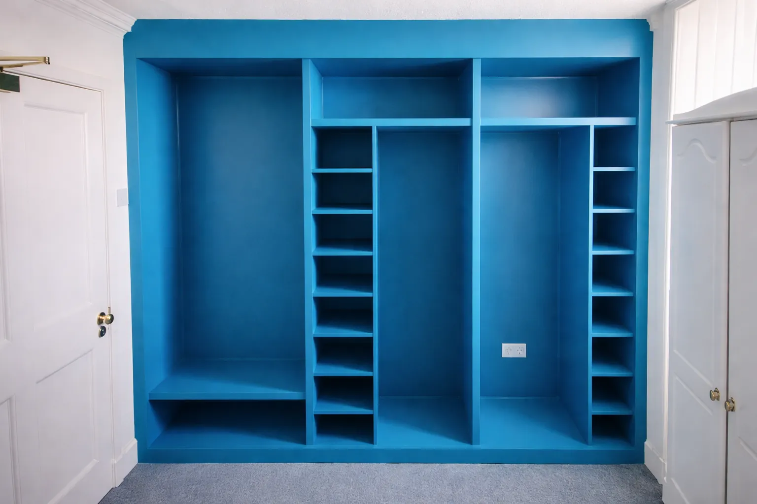 Blue fitted shelving and wardrobe unit in Edinburgh
